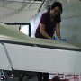 SEPTEMBER – Honorable Mention - Attention to Detail<br />Larry W. Wilson, Local Lodge 733, Hawker Beechcraft, Wichita, KS<br />Kim Phan wipes away foreign objects around the gas cap prior to the plane going to paint.<br />